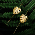 Boucles d'oreilles or feuilles monstres